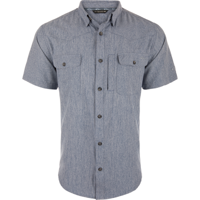 Cinco Ranch Chambray Performance Short Sleeve Shirt on mannequin, featuring point collar, two chest pockets, dark buttons, and Western yokes, ideal for versatile outdoor wear.