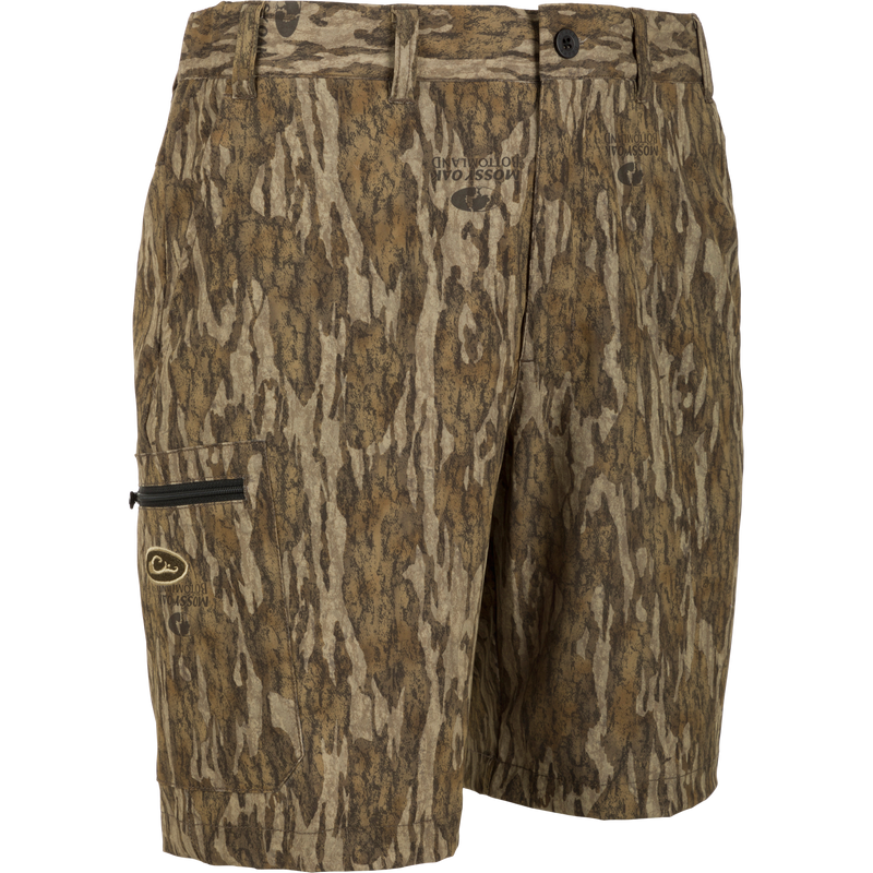 Bottomland camo shorts with logo detail, made of 92% Polyester and 8% Spandex, lightweight at 155 GSM, with built-in stretch and moisture-wicking features.