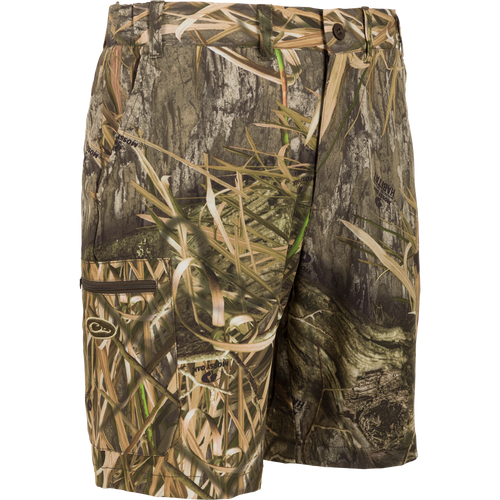 Traveler Trek Short,  Mossy Oak Shadow Grass Habitat shorts with built-in stretch, moisture-wicking fabric, and multiple pockets for your next adventure.