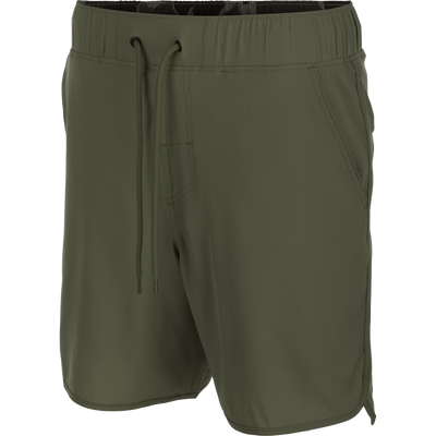 Commando Lined Volley Short 7in, featuring a scalloped hem, back zippered pockets, and an elastic waistband with drawstring, ideal for versatile, active wear.