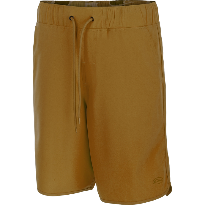 A versatile pair of Commando Lined Volley Shorts with a drawstring waist. Features include quick-drying fabric, moisture-wicking liner, and hidden zippered pockets. Perfect for beach to bar transitions.