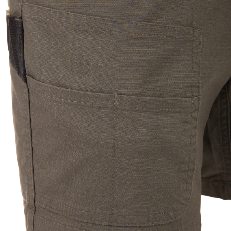 Close-up of the 9 Pocket Ripstop Short, showcasing the durable ripstop fabric and reinforced thigh cargo pocket, ideal for outdoor adventures and gear storage.