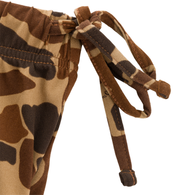 Close-up of Drake Lounge Pant's camo-print waistband with drawstring, showcasing the stretchy, adjustable fit for post-field comfort and relaxation.