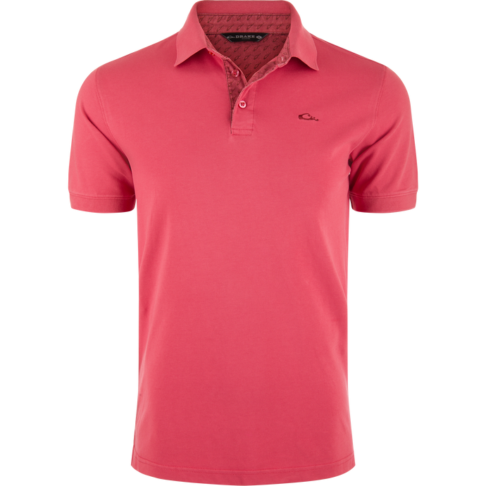 Pique Logo Polo features a classic three-button placket with ribbed collar and cuffs, embroidered Drake duck logo on chest, emphasizing modern performance and timeless style.