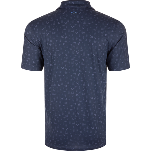 Marsh Duck Polo featuring a dark navy, bird-and-reeds pattern with a simple knit collar and contrasting logo, ideal for golf or casual wear.