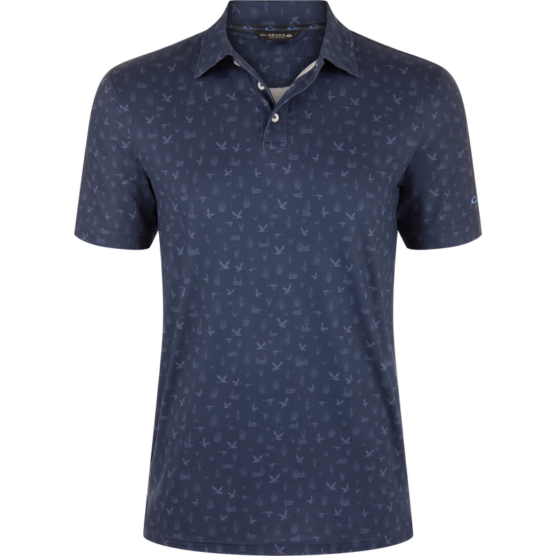 Marsh Duck Polo: Men's navy short-sleeve polo with flying birds and marsh-grass pattern, classic collar, two-button placket, ideal for casual or smart-casual wear.