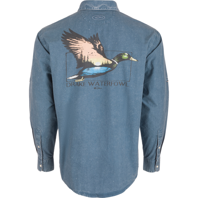 Back view of the Cinco Ranch Cotton Acid Wash Graphic Shirt featuring a flying duck graphic with sunset, treeline, water, and DRAKE WATERFOWL text.