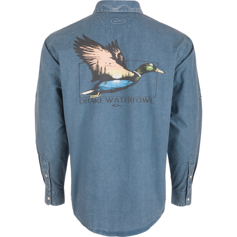 Back view of the Cinco Ranch Cotton Acid Wash Graphic Shirt featuring a flying duck graphic with sunset, treeline, water, and DRAKE WATERFOWL text.
