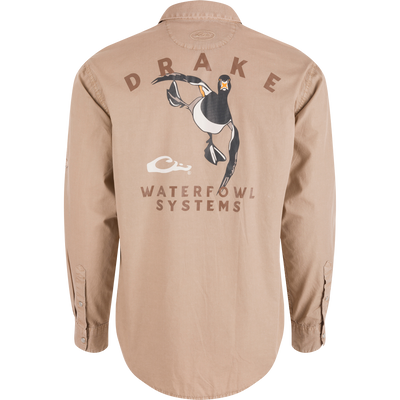 Back view of Cinco Ranch Cotton Acid Wash Graphic Shirt featuring DRAKE text, flying duck graphic, and WATERFOWL SYSTEMS. Rounded hem and buttoned cuffs visible.
