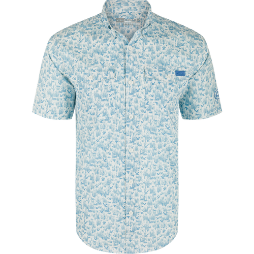 Cotton Marsh Print Short Sleeve Shirt featuring light-blue nature print, button-down collar, chest pockets, and sculpted hem, displayed on a hanger, embodying Drake Waterfowl's casual style.