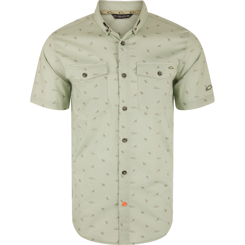 Cotton DDD Print Shirt with button-down collar, flap chest pockets, and bird and animal motifs. Features a distinctive orange accent button and Drake branding.
