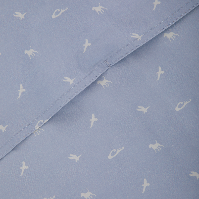 Cotton DDD Print Shirt close-up featuring light-blue fabric with small white animal and bird silhouettes, highlighting intricate stitching and seamless design. Ideal for casual, outdoor-inspired wear.