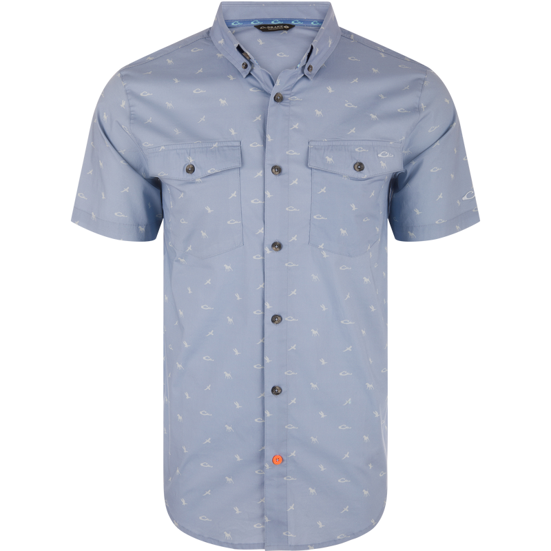 Cotton DDD Print Shirt with button-down collar, featuring light-blue short sleeves, two chest pockets, small white motifs, and a unique orange button on the placket.