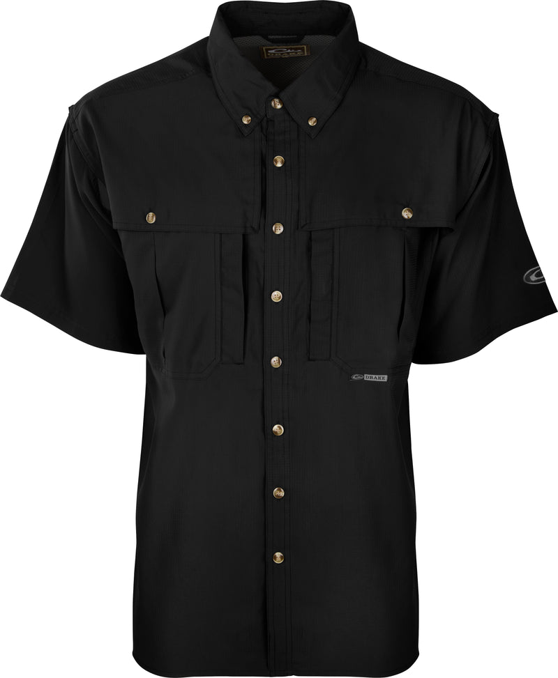 A black Flyweight Wingshooter's Shirt S/S: Ultra-lightweight black shirt with buttons. Ideal for warm-weather outdoor activities. Features Sol-Shield™ UPF 50+, Magnattach™ chest pocket, and quick-drying Flyweight polyester fabric.