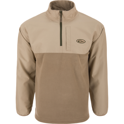 Eqwader Half Zip Pullover featuring a light tan design with a waterproof upper shell, fleece lower body, stand-up collar, and zippered chest pocket, ideal for waterfowl hunting.