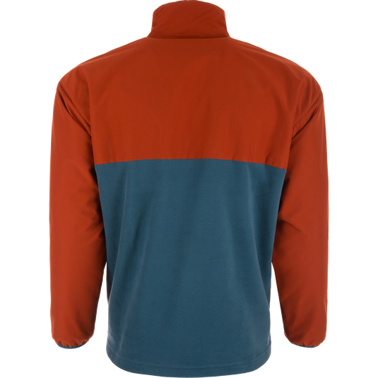 Eqwader Half Zip Pullover displayed from the back, featuring a rust-orange upper and teal-blue lower, with waterproof upper shell and breathable lower shell on a mannequin.