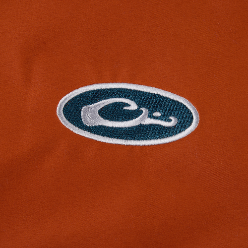 Eqwader Half Zip Pullover featuring a dark teal embroidered patch; offers waterproof upper shell and breathable lower shell for enhanced comfort and performance in hunting.