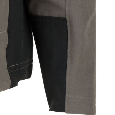 Close-up of the Rain Brake Lightweight Softshell Jacket, highlighting its adjustable hood and YKK zippered pockets, perfect for wet weather protection.