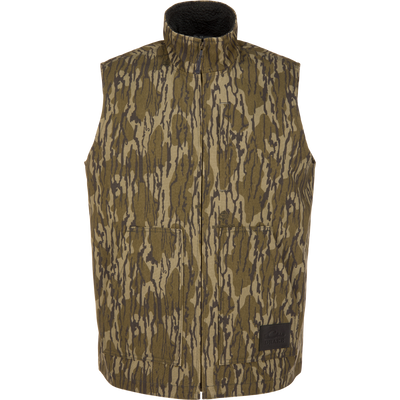 Lifestyle Canvas Sherpa Lined Work Vest in Mossy Oak Original Bottomland camo-print canvas with a high collar, sherpa lining, and two front patch pockets.