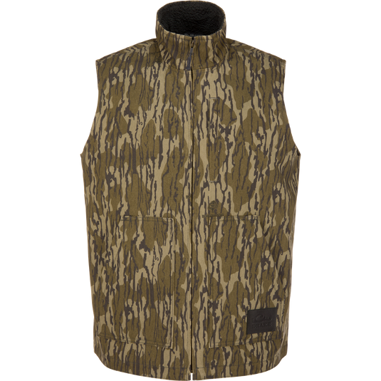 Lifestyle Canvas Sherpa Lined Work Vest in Mossy Oak Original Bottomland camo-print canvas with a high collar, sherpa lining, and two front patch pockets.