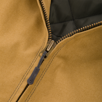 Close-up of a tan Duck Canvas Work Jacket featuring a metal zipper with a dark grey pull tab.