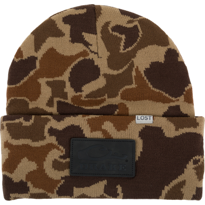 Lost Hat Work Beanie featuring camo pattern, fold-over cuff with LOST label, and DRAKE leather patch, crafted from 100% acrylic for quality fit.
