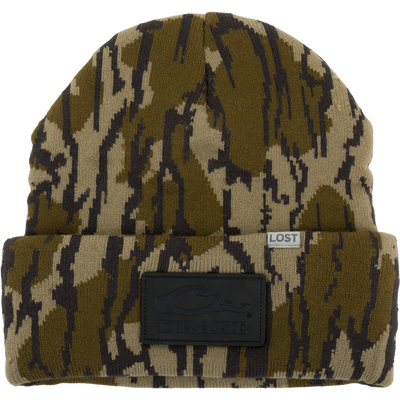 Lost Hat Work Beanie in camouflage features a 4 flip cuff with LOST label and DRAKE leather patch, crafted from seamless 100% Acrylic for quality fit.