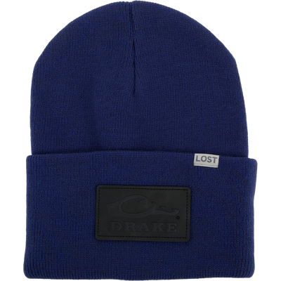 Lost Hat Work Beanie with ribbed knit, 4 flip cuff, seamless construction, and embossed DRAKE patch, ideal for cold-weather comfort and quality fit.