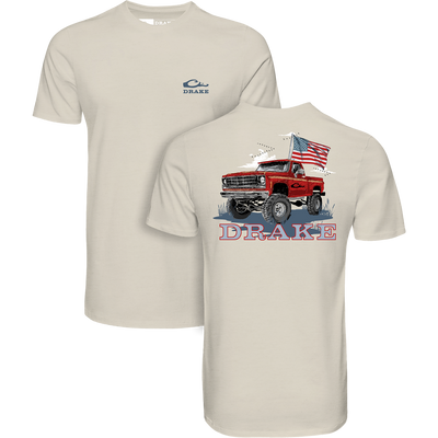 Youth Americana Flag Truck T-Shirt with a chest Drake logo and a back illustration of a red pickup truck with an American flag.
