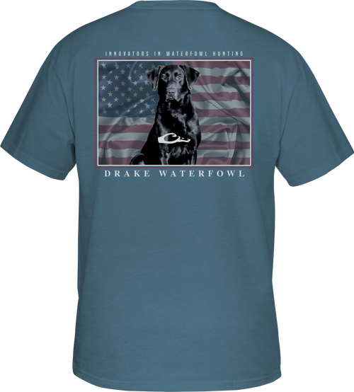 A blue shirt with a dog and an American flag overprint, featuring the Drake logo pocket on the front - Americana Lab T-Shirt.