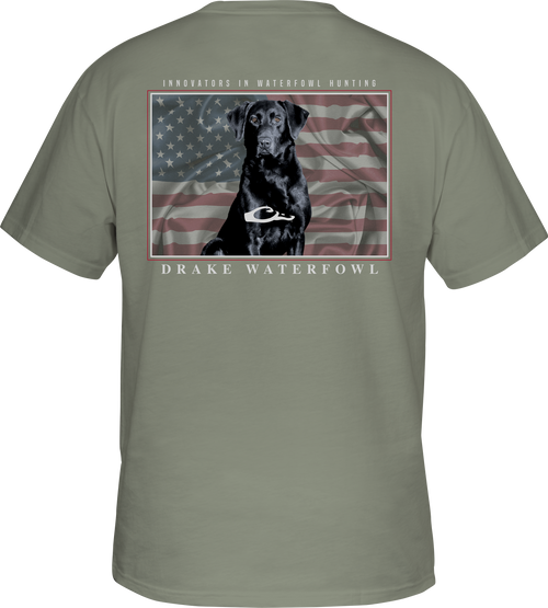 A grey t-shirt featuring a dog and an American flag from the Americana Lab T-Shirt collection by Drake Waterfowl.