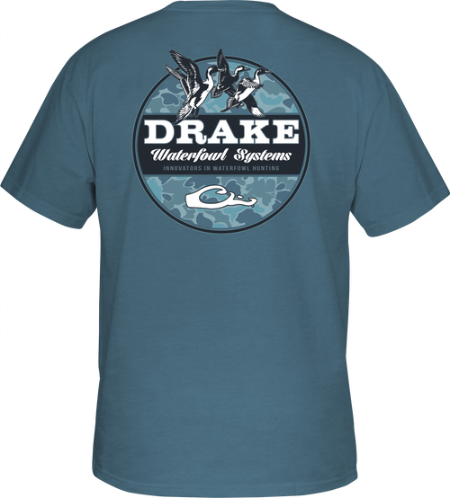 Old School Circle T-Shirt with a logo of ducks flying in the air, on a blue background. Lightweight and comfortable 60% cotton/40% polyester blend. Drake Waterfowl Graphic Tee from the Old School Camo Series of back graphic tees.