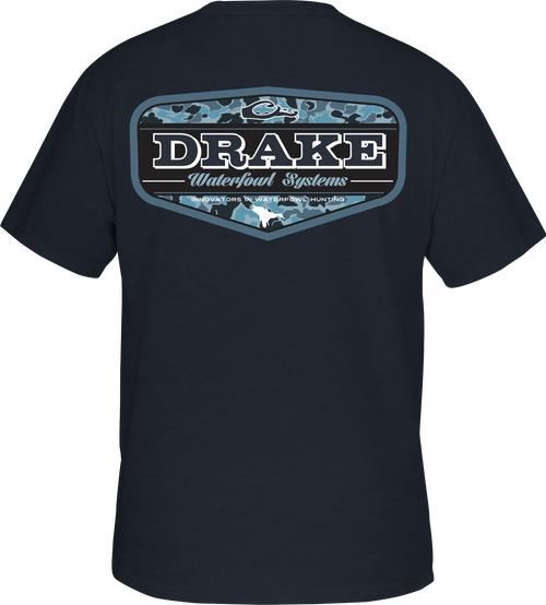 A black shirt with a logo on the back, featuring a camouflage pattern from the Old School Camo Series. Drake Waterfowl Graphic Tee.