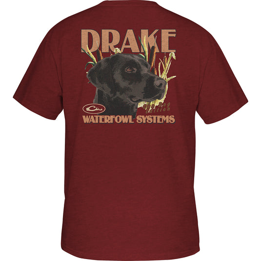 A red shirt with a dog graphic on the back, featuring a Lab from the Vintage Drake Series. Drake logo on the front pocket. Lightweight and comfortable. Marsh Lab T-Shirt.