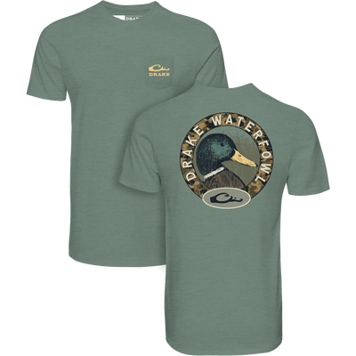 Mallard Circle T-Shirt displays a camo crest with a duck's head and DRAKE WATERFOWL, plus Drake logo on pocket, highlighting comfort and style.