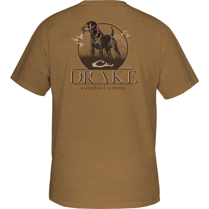A Drake Waterfowl Standing Black Lab T-Shirt featuring a Lab graphic on the back and Drake logo on the front pocket. Made of 60% cotton and 40% polyester for comfort and durability.
