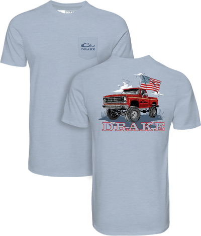 Americana Flag Truck T-Shirt featuring a red pickup illustration and DRAKE logo, crafted from lightweight cotton-poly blend for comfort and style.