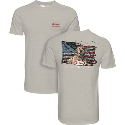 Americana Yellow Lab Flag T-Shirt featuring front pocket Drake logo and back graphic of a golden retriever with an American flag and Dedication Innovation text.