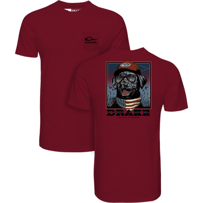 Bandana Lab Flag T-Shirt featuring a chest pocket with Drake logo, and a graphic of a dog in aviators and bandana, embodying Drake Waterfowl's outdoor style.