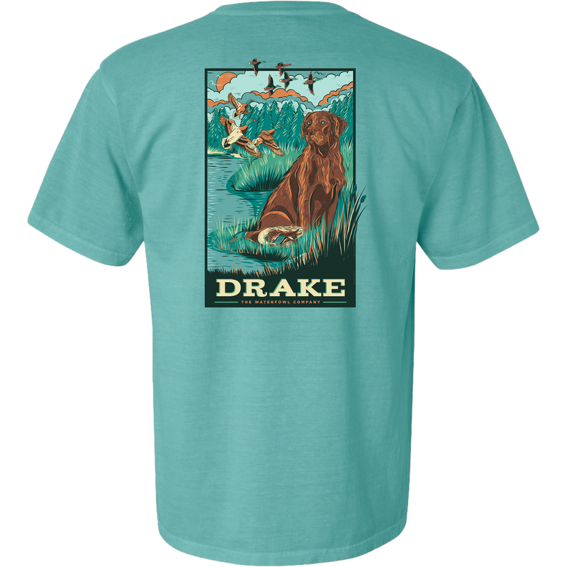 Waterfowl Lab T-Shirt featuring a vintage-style graphic of a retriever by a pond, marsh grasses, ducks, and DRAKE THE WATERFOWL COMPANY text, ideal for hunting enthusiasts.