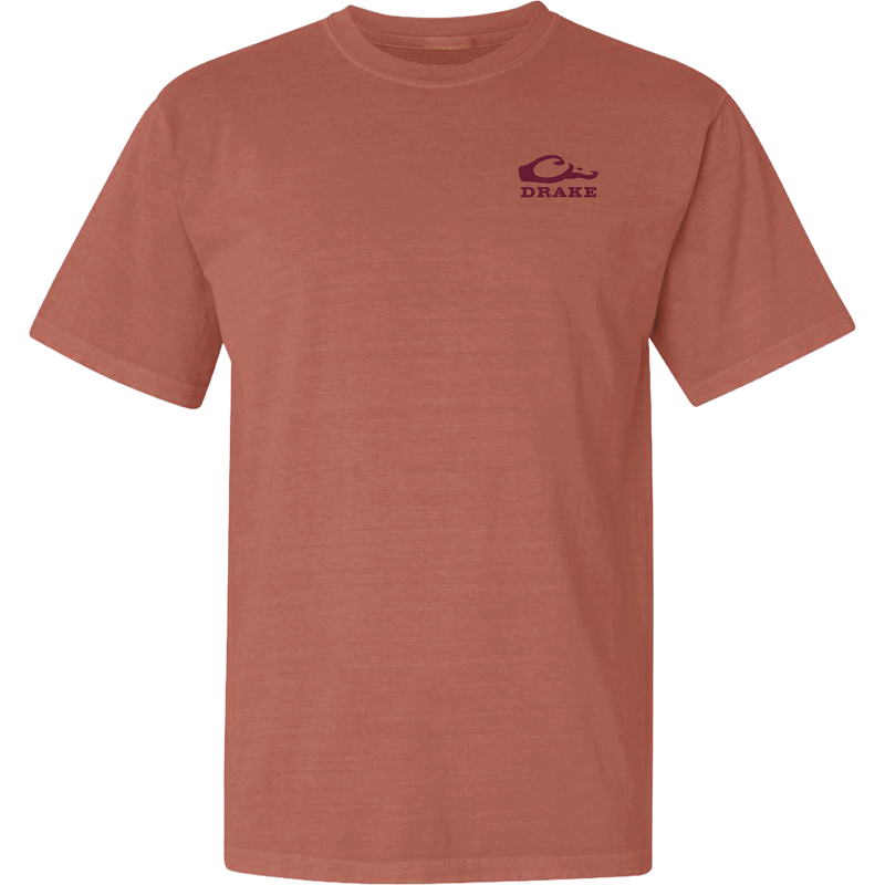 Don’t Let Em Behind You T-Shirt features a rust-colored design with a maroon wave logo and 'DRAKE' text on the chest, crafted from soft 100% cotton.
