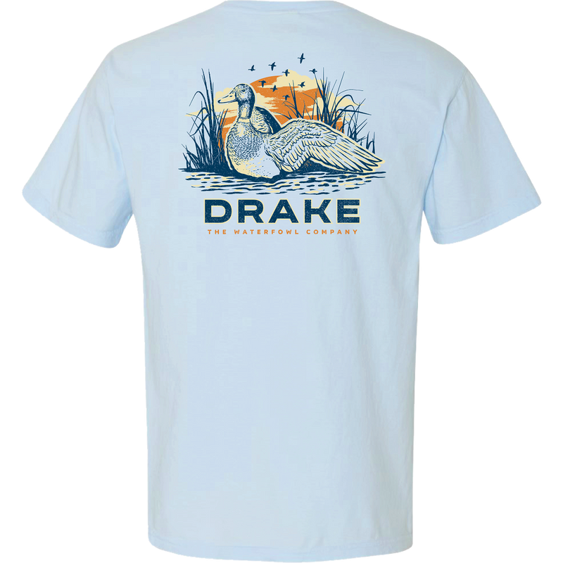Morning Mallard T-Shirt featuring a drake in marsh reeds with a setting sun, bold DRAKE text, and THE WATERFOWL COMPANY below.