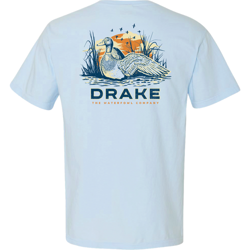 Morning Mallard T-Shirt featuring a drake in marsh reeds with a setting sun, bold DRAKE text, and THE WATERFOWL COMPANY below.