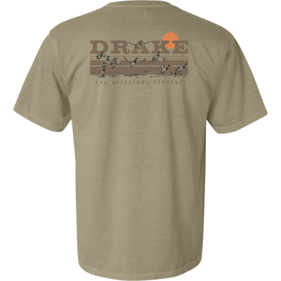Back of the Take Flight T-Shirt featuring the Drake Waterfowl logo, orange sun, and ducks in flight across a marsh, highlighting outdoor hunting themes.