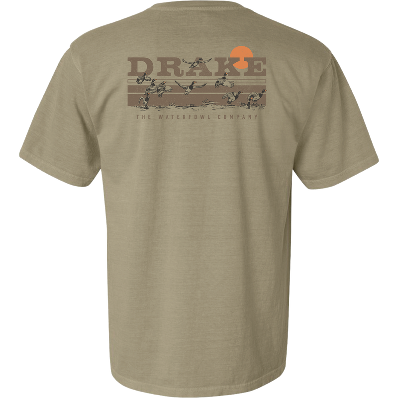 Back of the Take Flight T-Shirt featuring the Drake Waterfowl logo, orange sun, and ducks in flight across a marsh, highlighting outdoor hunting themes.