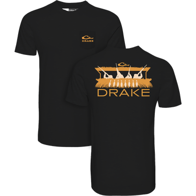 Blind Bust T-Shirt with Drake's orange logo and duck-hunting scene, offering a comfortable, durable blend of cotton and polyester for versatile outdoor wear.