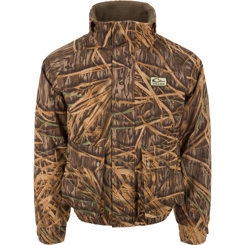 Throwback 80 Insulated Sport Bomber Jacket with camouflage pattern, high collar, snap pockets, and Drake patch, designed for warmth and protection during hunting activities.