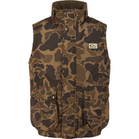 Throwback 80 Sport Vest in camouflage with high collar, snap-front, and two flap pockets; ideal for outdoor enthusiasts requiring warmth and weather protection.