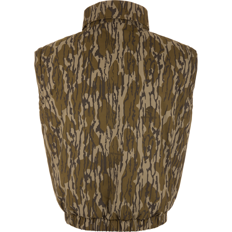 Throwback 80 Sport Vest from Drake Waterfowl, featuring a camouflage pattern, stand-up collar, elastic waistband, and large accessory pockets, ideal for outdoor adventures.