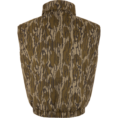 Throwback 80 Sport Vest from Drake Waterfowl, featuring a camouflage pattern, stand-up collar, elastic waistband, and large accessory pockets, ideal for outdoor adventures.